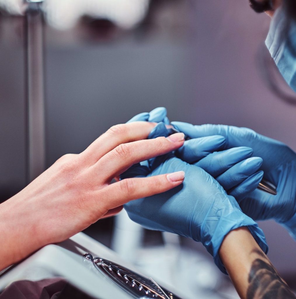Hardware manicure in a beauty salon
